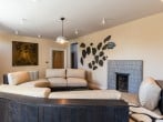 Living room with curved sofa Living room with curved sofa